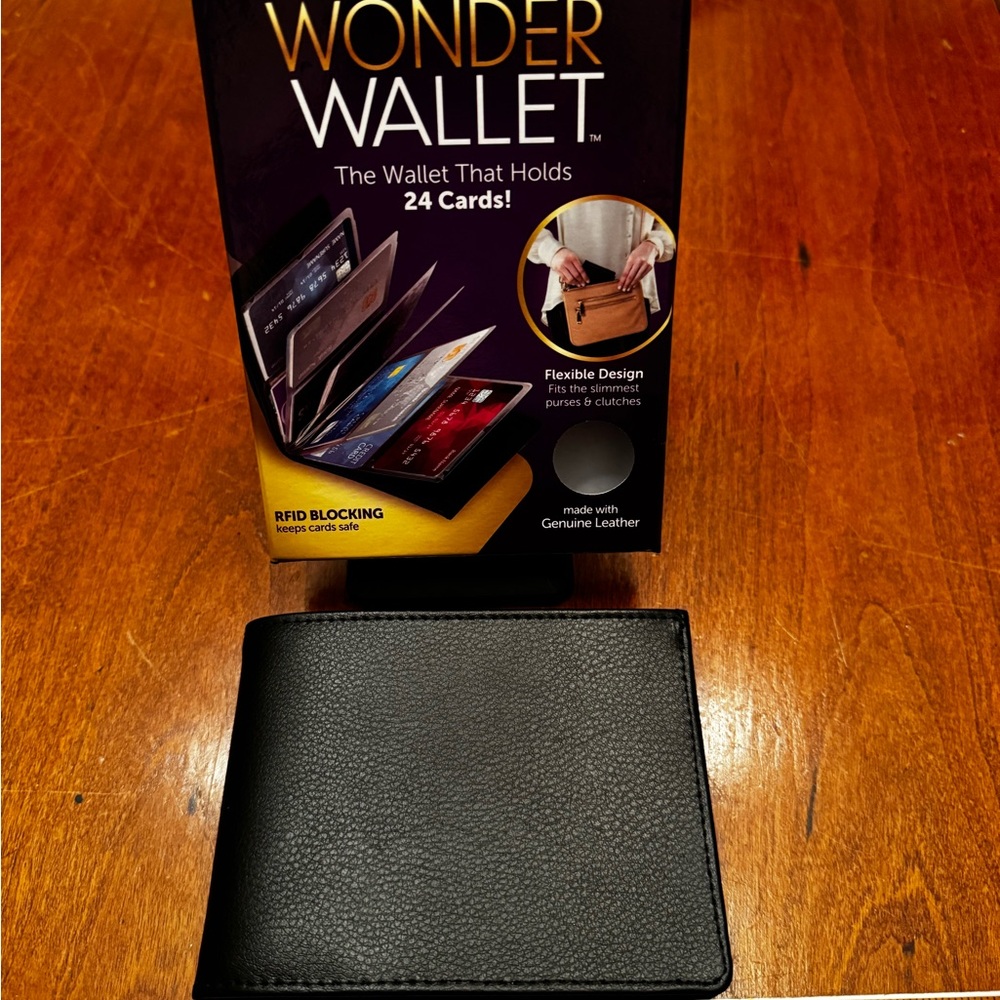 Wonder Wallet! NEW in original box, holds 24 cards. Flexible, Genuine leather.